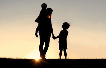 photo of mother with two small children